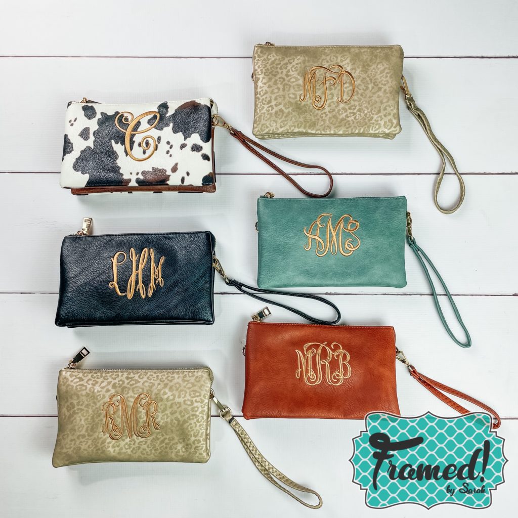 Monogrammed Compartment Crossbody bags laid on a white backdrop