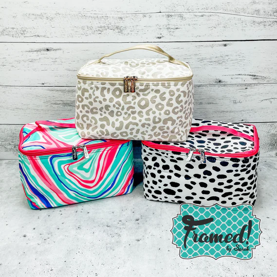 Printed Cosmetic Bags stacked by a wood wall_The Best Gifts for Teen Girls_Teen Girl Gift Guide