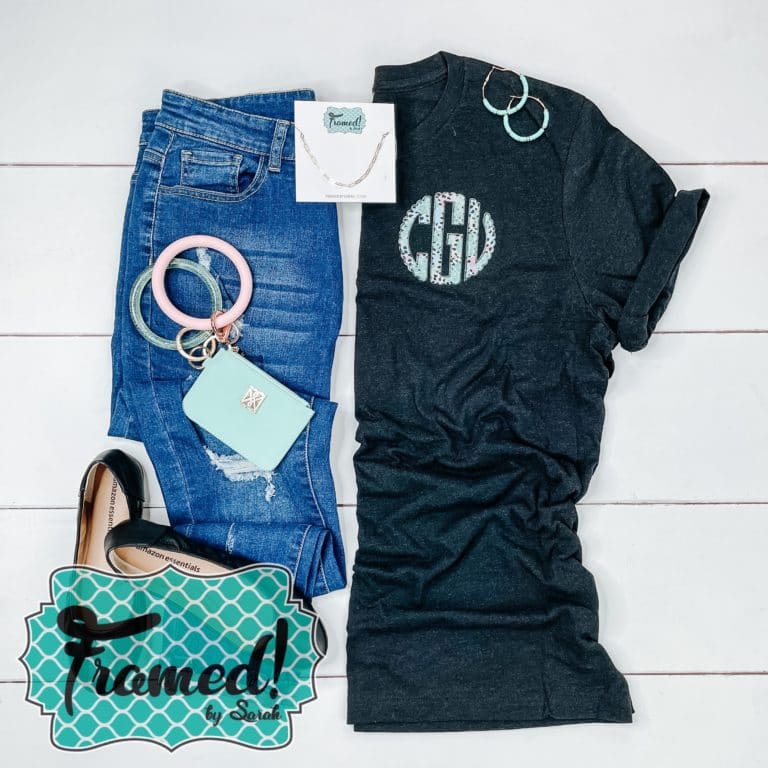 Monogrammed black tee styled with jeans