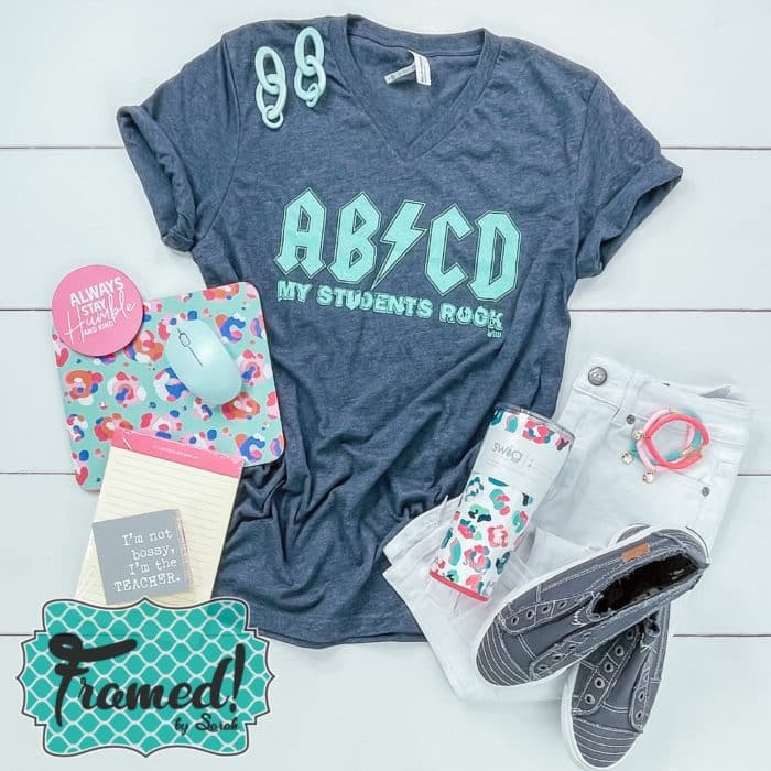 ACDC teacher tee paired with white jeans and pink and teal accessories