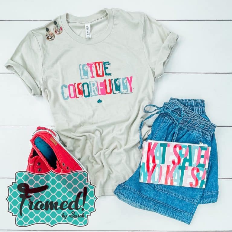 Gray tee shirt with colorful "live colorfully" lettering styled with red shoes, drawstring denim shorts, and some simple earrings and Kate Spade Notebook
