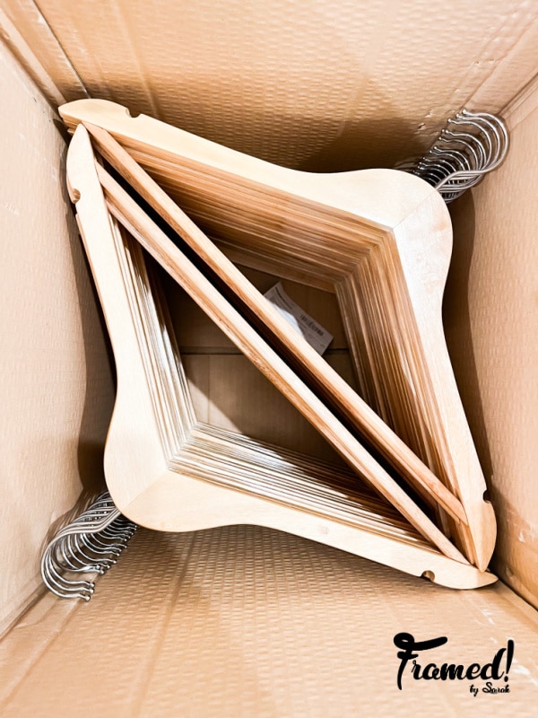 brown box full of wood hangers