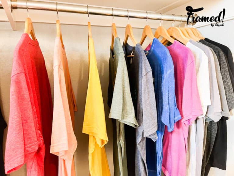 Single T-shirts hung in a ROYGBIV pattern How to organize your closet by color