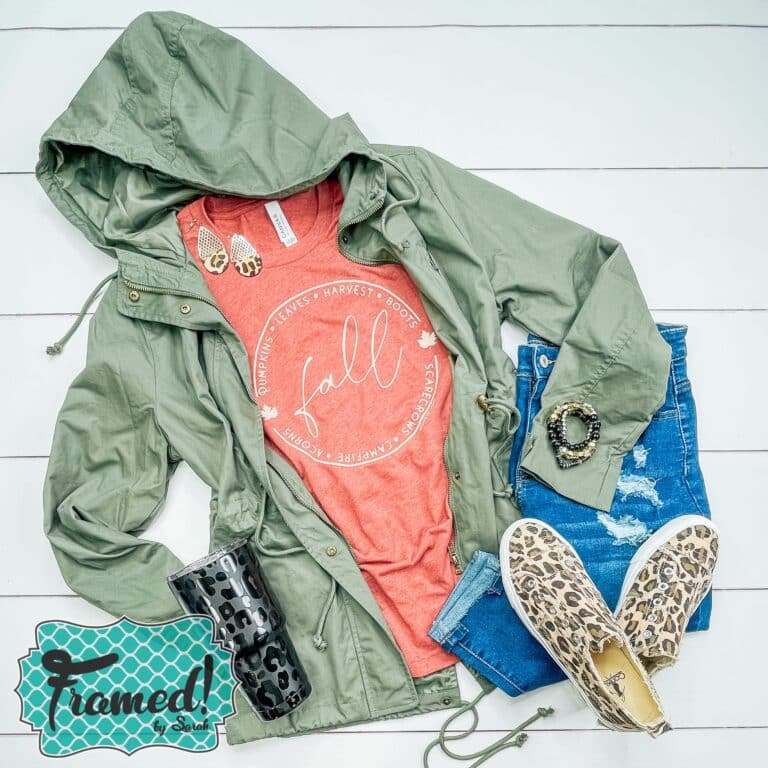 orange fall tshirt styled with green jacket, leopard shoes, and jeans
