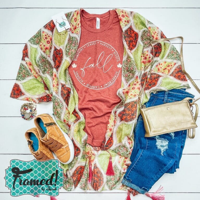 orange fall graphic tee styled with a multi colored kimono, gold clutch and jeans