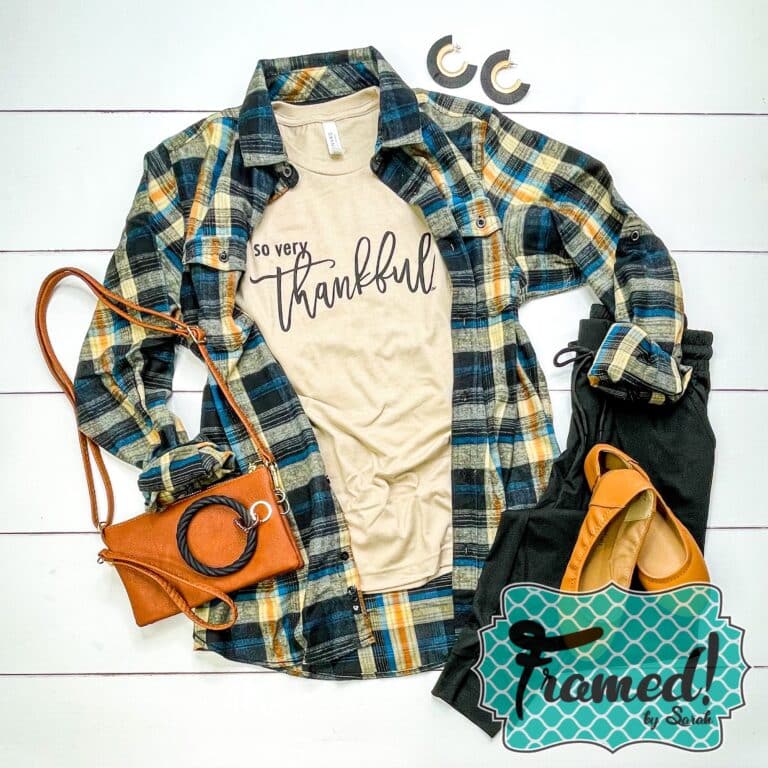 Tan "Oh So Thankful" graphic tshirt styled with a green, gold, and black flannel and camel purse and shoes