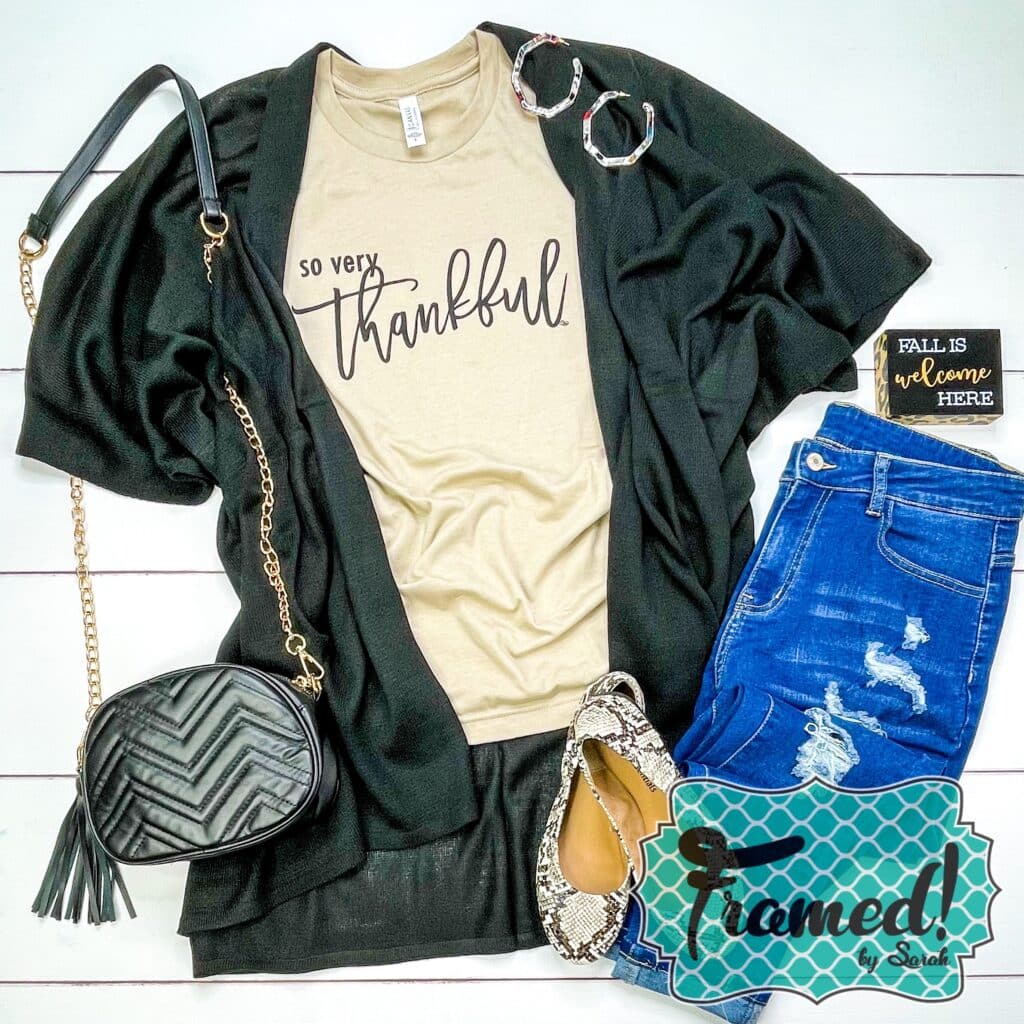 Tan "Oh So Thankful" graphic tshirt styled with a black flowy kimono, black sling clutch, snake skin flats, and jeans