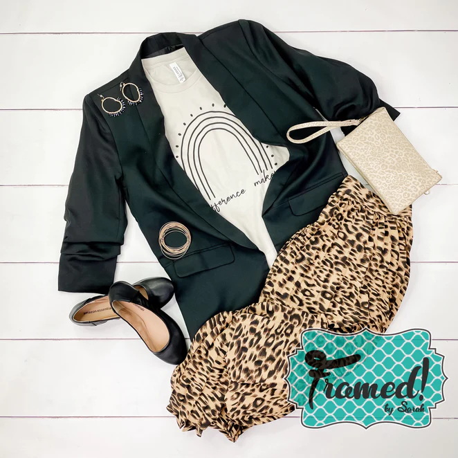 Black blazer styled with ivory "difference maker" rainbow tshirt, cheetah print skirt, black flats and ivory clutch.