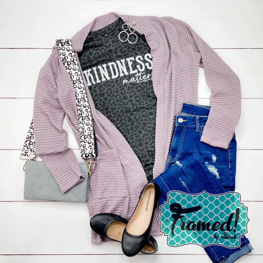 Lavender lola cardigan styled with the black and gray leopard print "Kindness Matters" tee, blue jeans, black flats, and a cray cross body bag