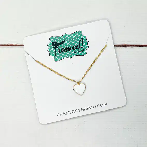 gold necklace with enamel white heart