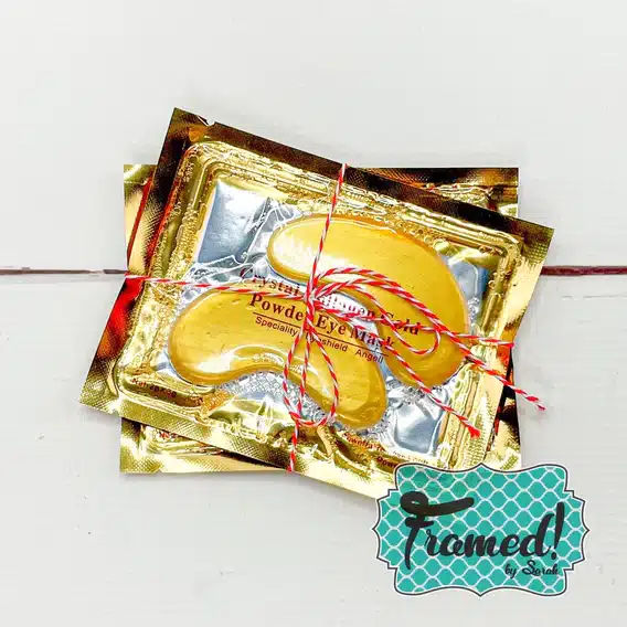 Set of 2 gold Collagen Eye Masks tied with a bow