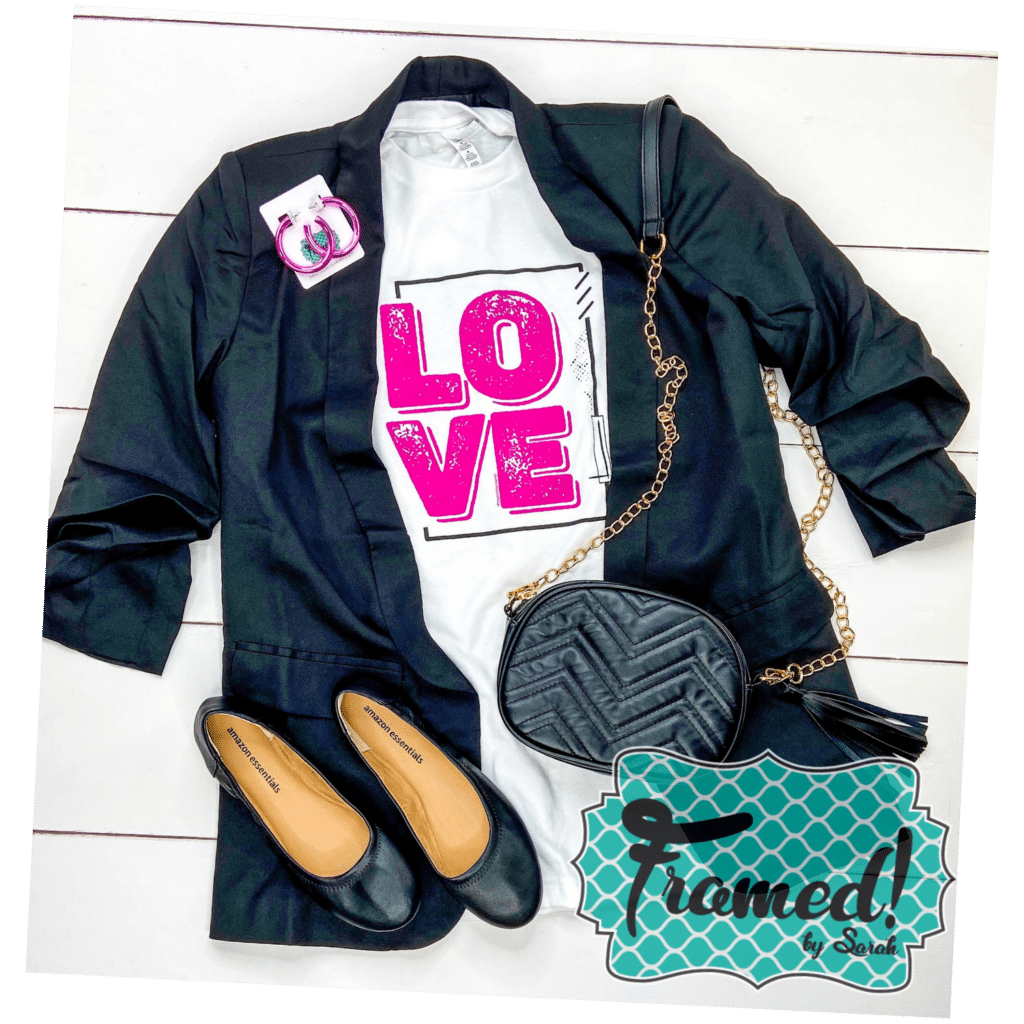 white "LOVE" tshirt styled with a black blazer and accessories