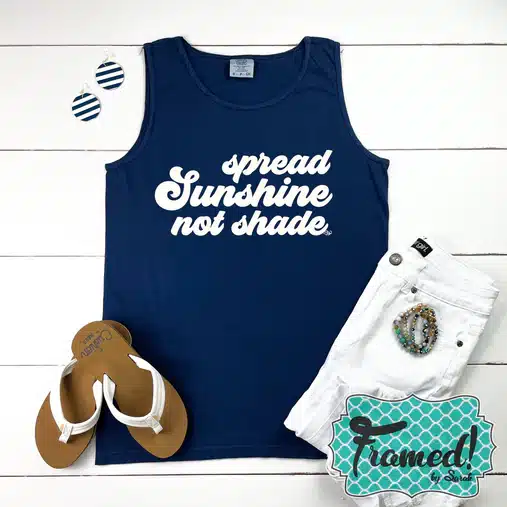 navy blue tak top that says "spread sunshine not shade" styled with white jeans and sandals