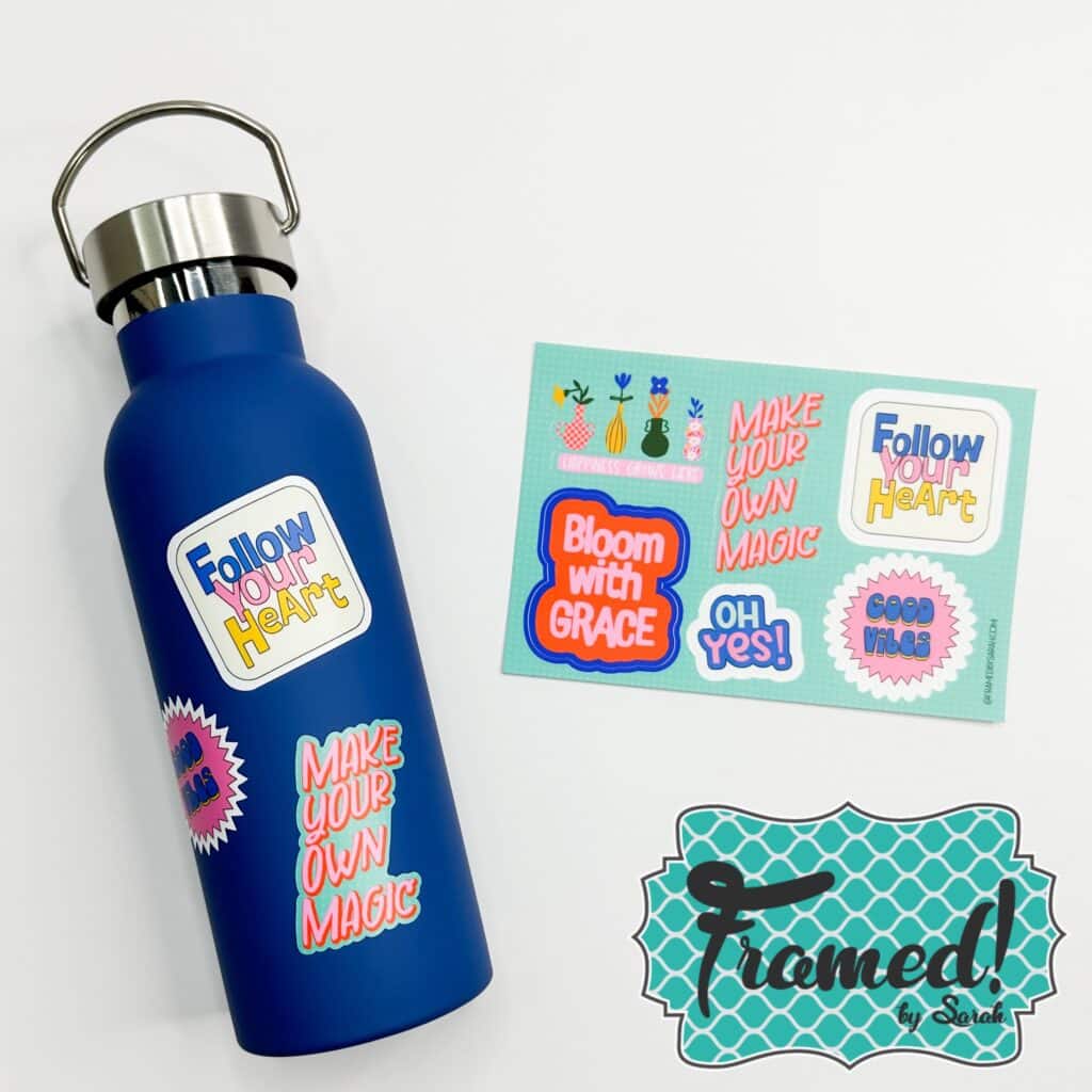 Navy blue water bottle with stickers on the bottle and a paper of stickers.