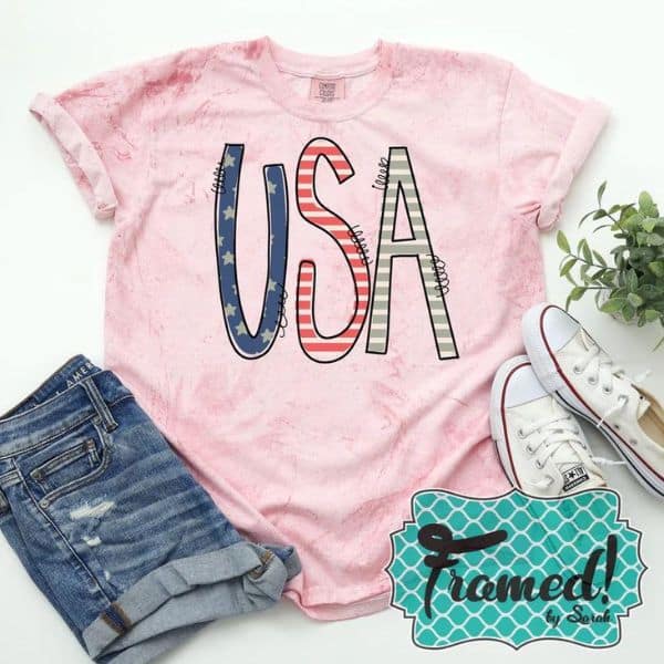 Pink USA graphic tee styled with jean shorts and white tennis shoes