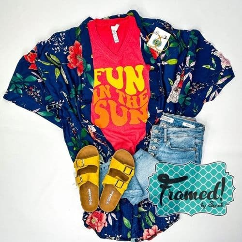 Red "Fun in the Sun" graphic tee styled with jeans, floral print navy Kimono, hoop earrings, yellow sandals