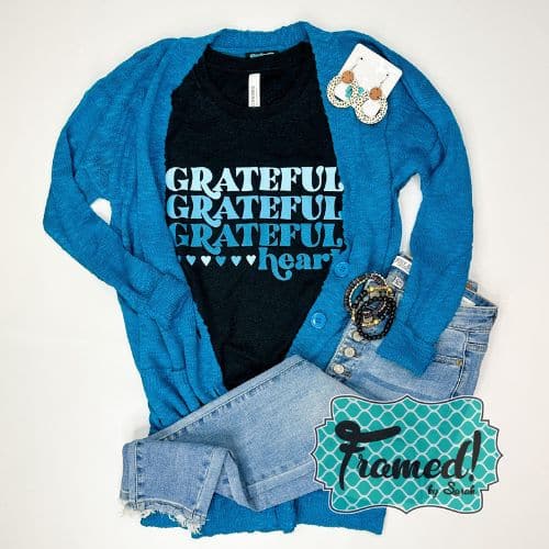 Black tshirts with the words "Grateful Grateful Grateful Heart" styled with blue cardigan and jeans