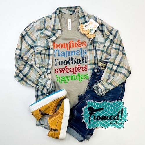 September T-shirt Club Gray shirt with colorful fall words tee styled with gray flannel shirt, jeans, and camel sneakers.