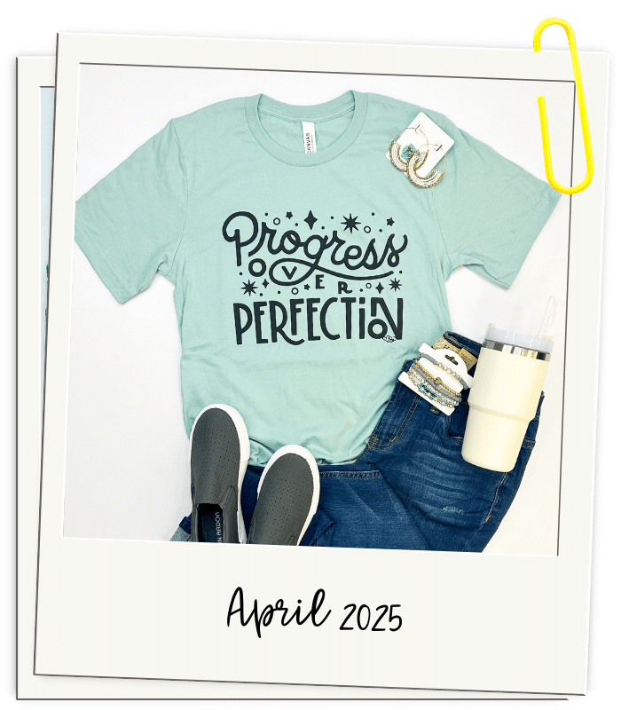 polaroid graphic with April 2025 aqua Progress Over Perfection graphic tee for teachers _Framed by Sarah Tees for Teachers
