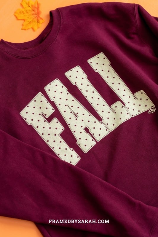 close up of the polka dot "fall" maroon sweatshirt
