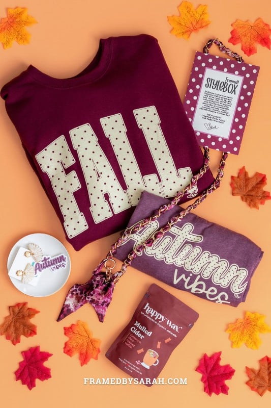 Maroon "fall" sweatshirt, scarf phone chain, cider wax melts, and print insert.