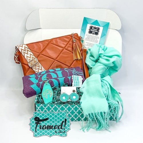 camel color quilted purse, mint scarf, mint monogrammed key fob, purple and mint graphic tshirt, mint earrings all displayed in the Monogram Box_Feb 2024 Monogram Box - Ultimate Box 3